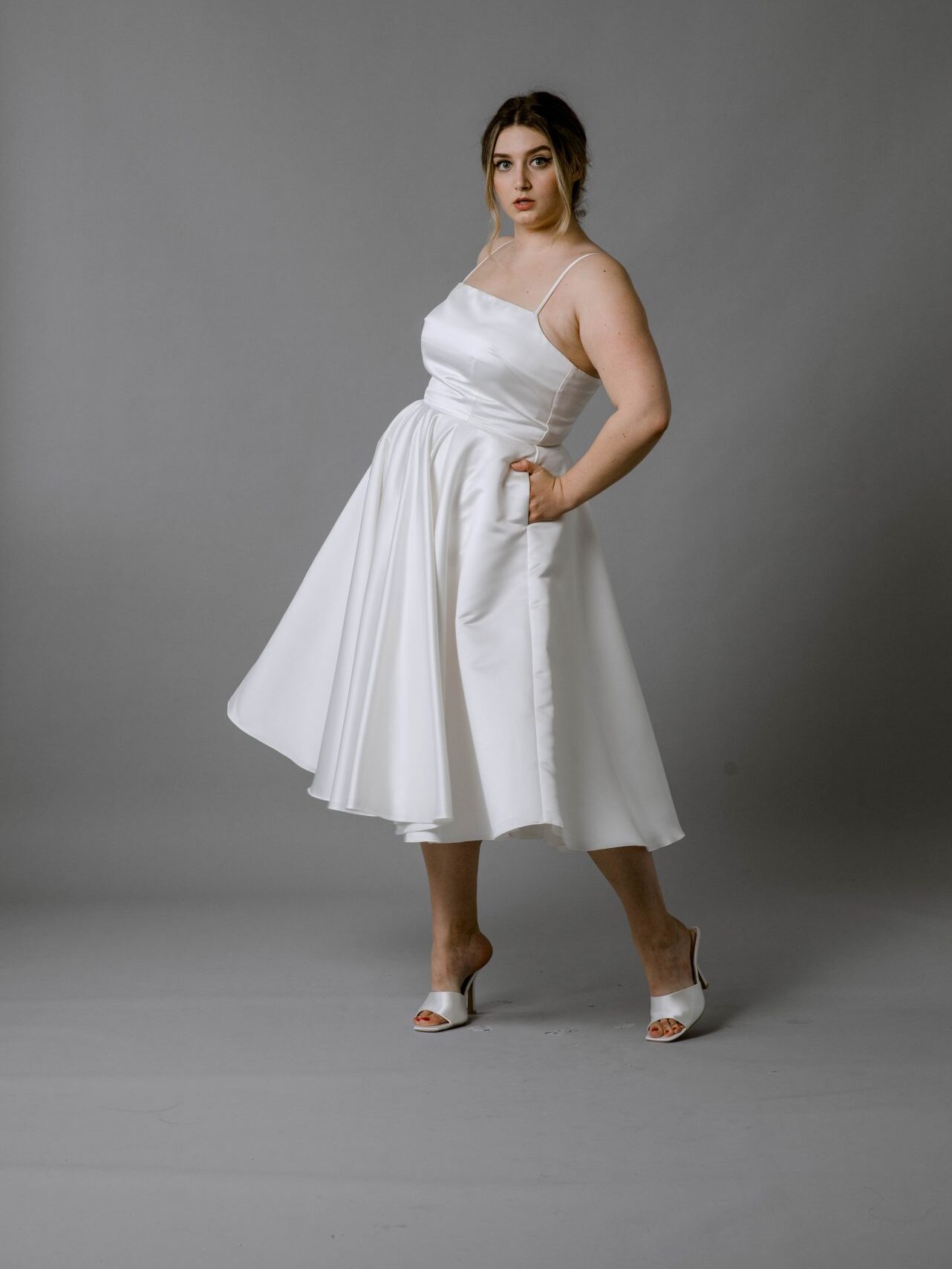 A model wearing a bridal dress from Rita Colson.