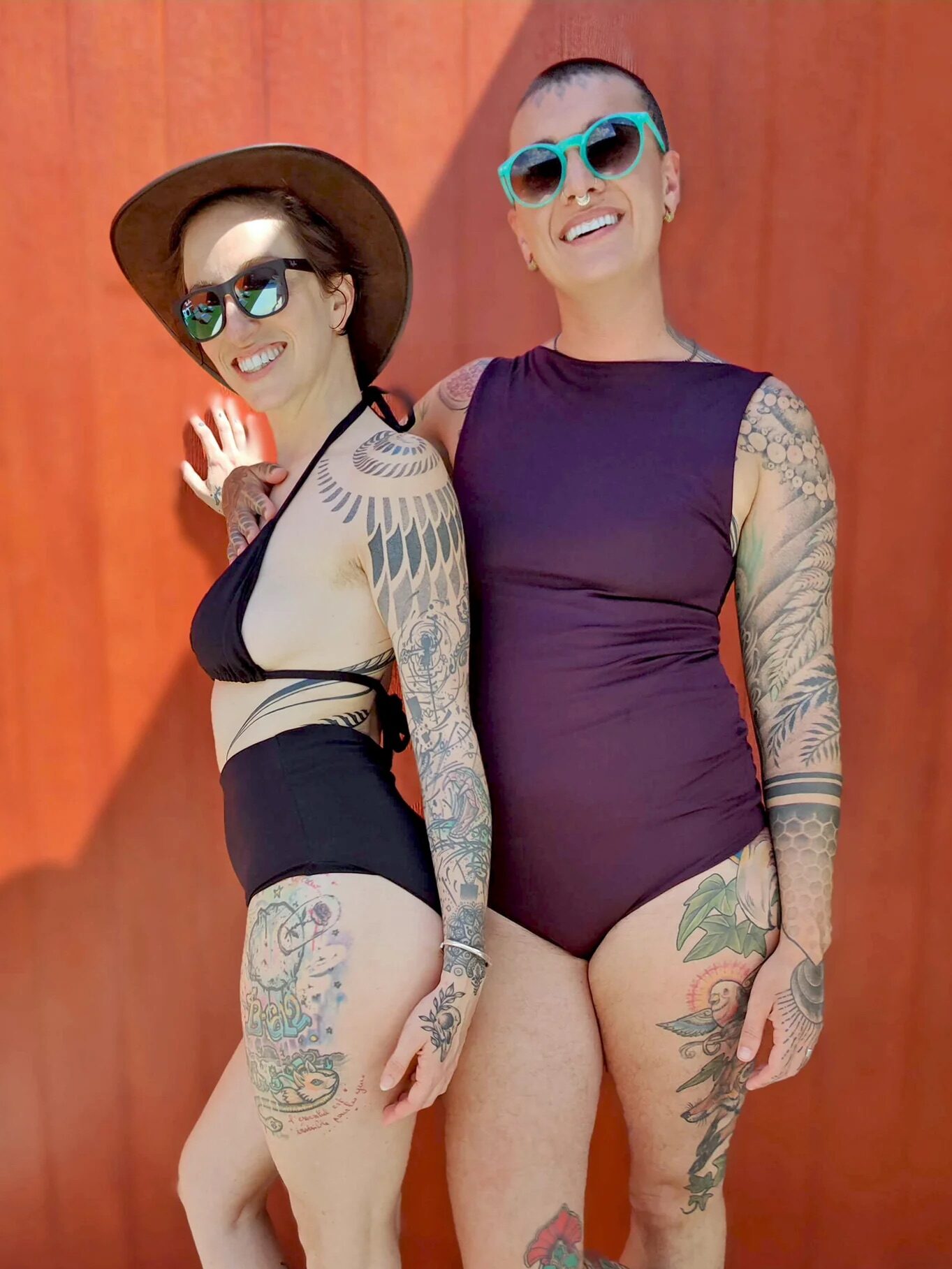 Two models wearing swimsuits from Origami Customs. 