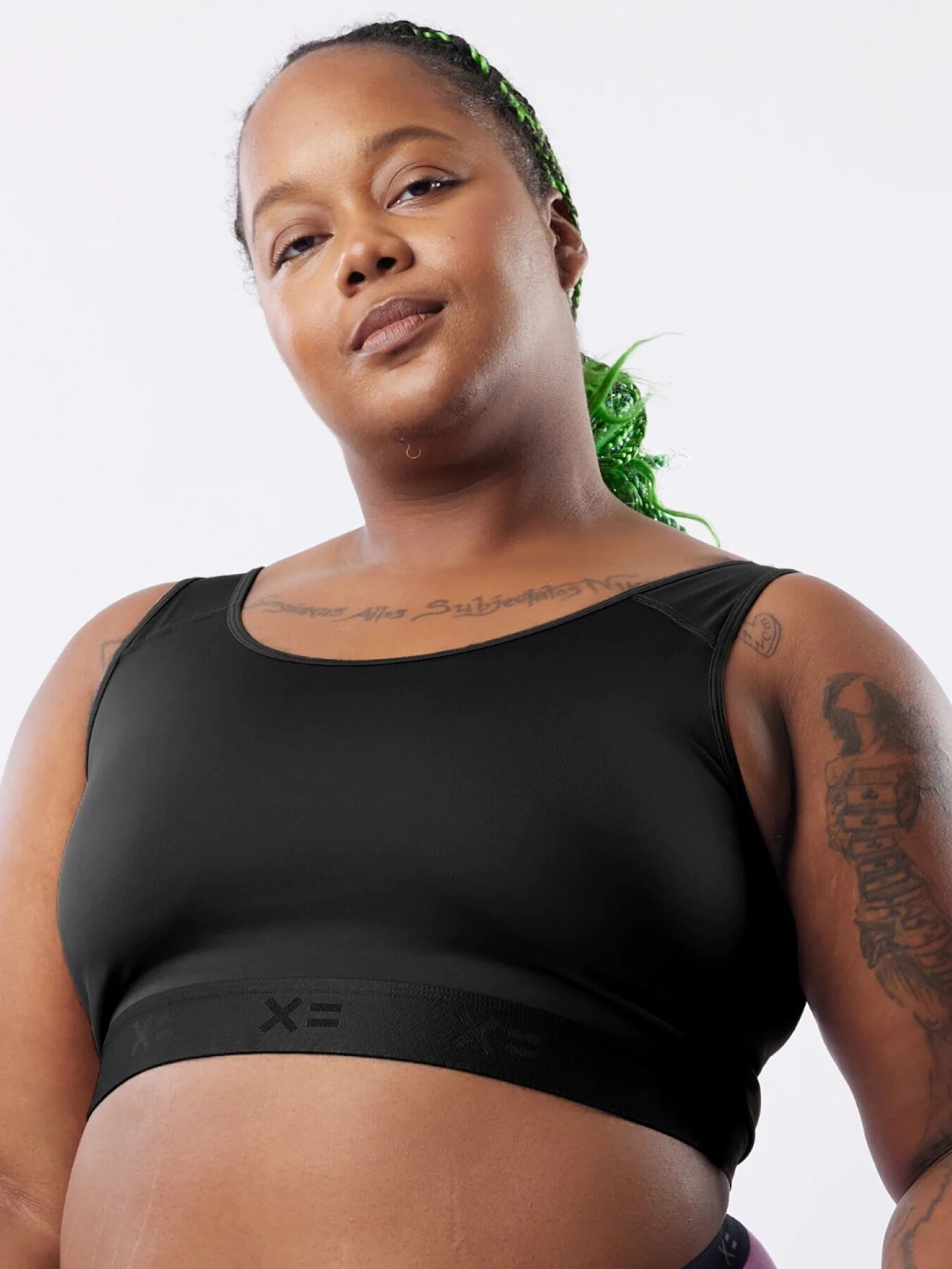 A model wearing a black compression bra. 