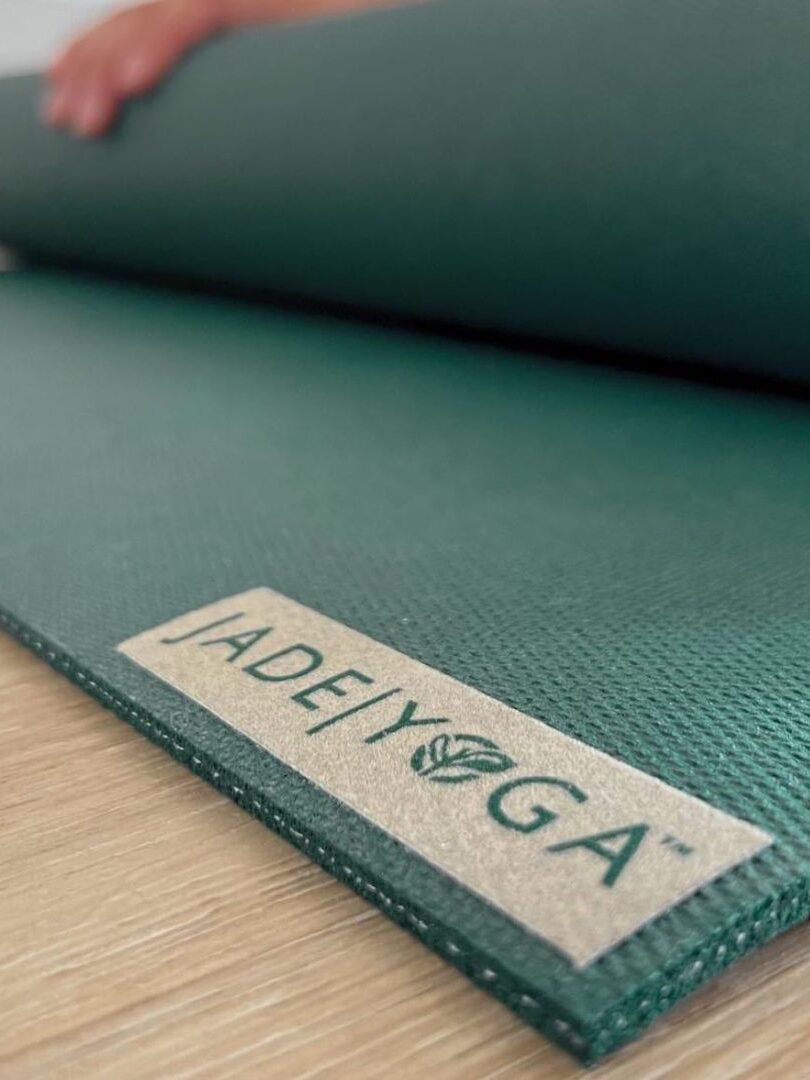 A green Jade Yoga mat. 