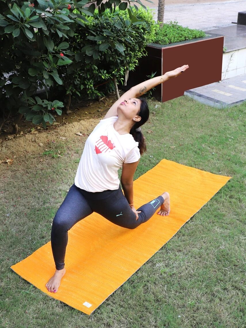 A model practicing on a YogaKargha yoga mat. 