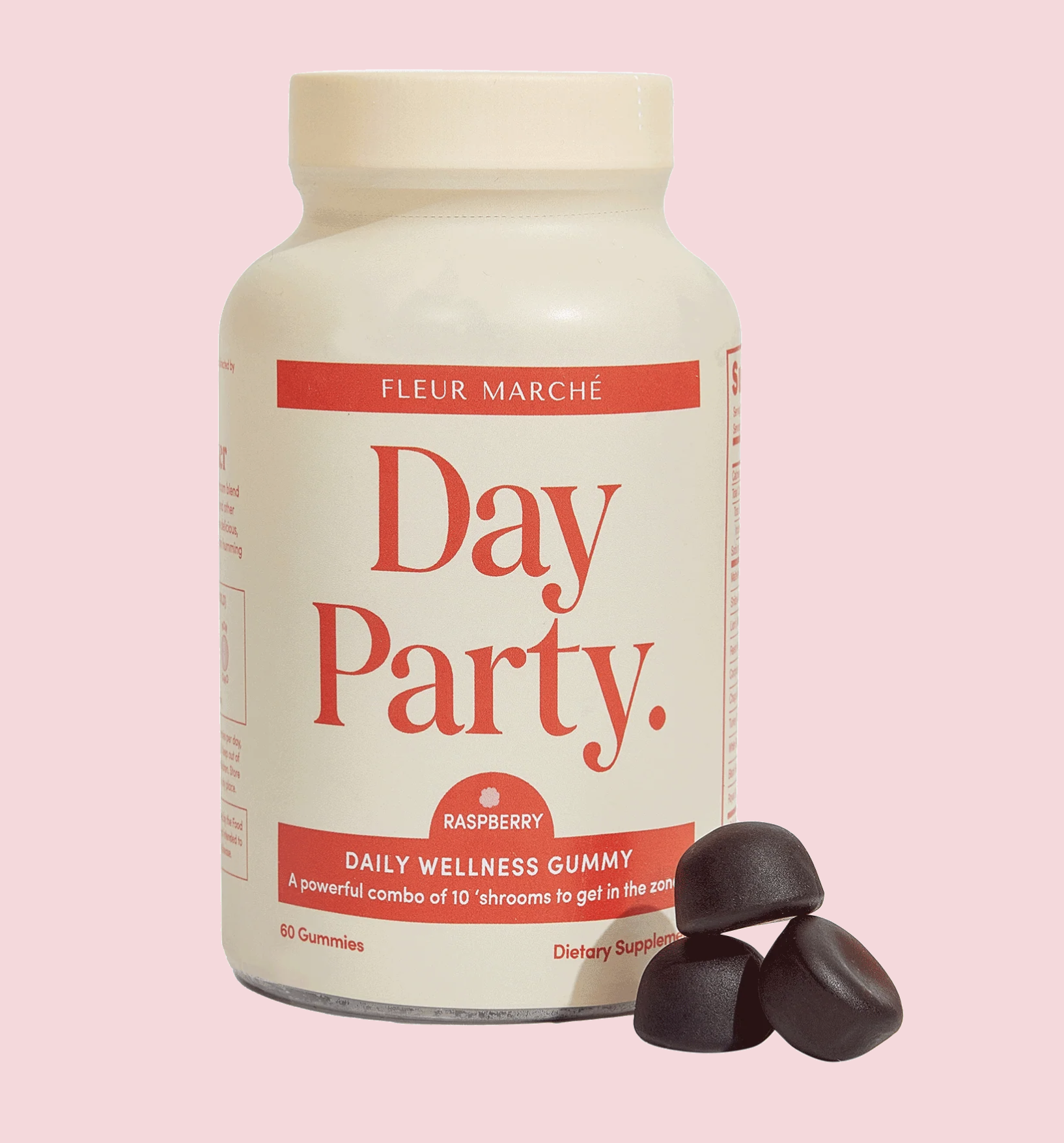 Bottle of Fleur Marché Day Party daily wellness gummies and a few gummies on a pink background.