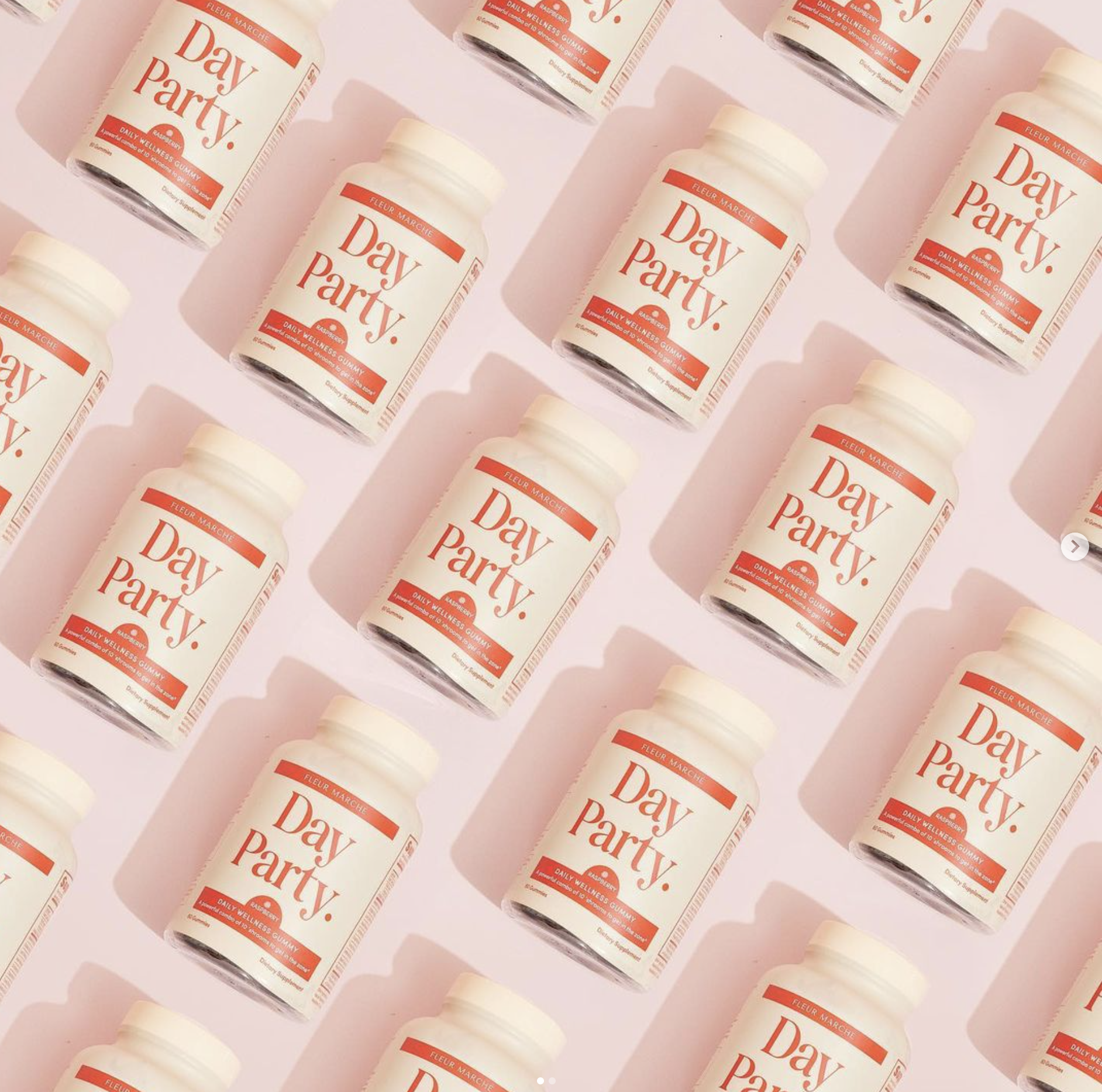 Rows of "Day Party" supplement bottles arranged diagonally on a light pink background.