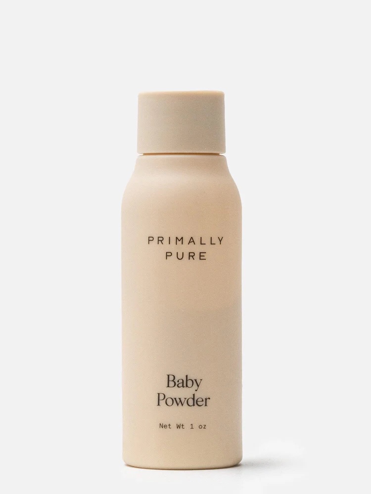 A beige bottle of Primally Pure Baby Powder, net weight 1 oz.