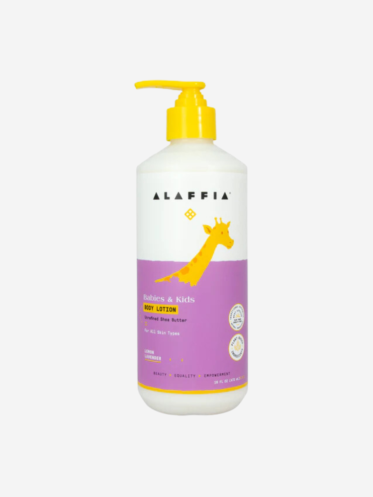 A bottle of Alaffia Babies & Kids Body Lotion with a yellow pump and giraffe design. The lotion is for all skin types, featuring shea butter and lavender chamomile scent.