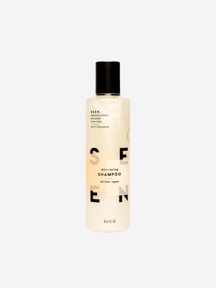 Clear bottle of SEEN Skin-Caring Shampoo with black cap on a plain background. Contains 8.6 fl oz, designed for all hair types.