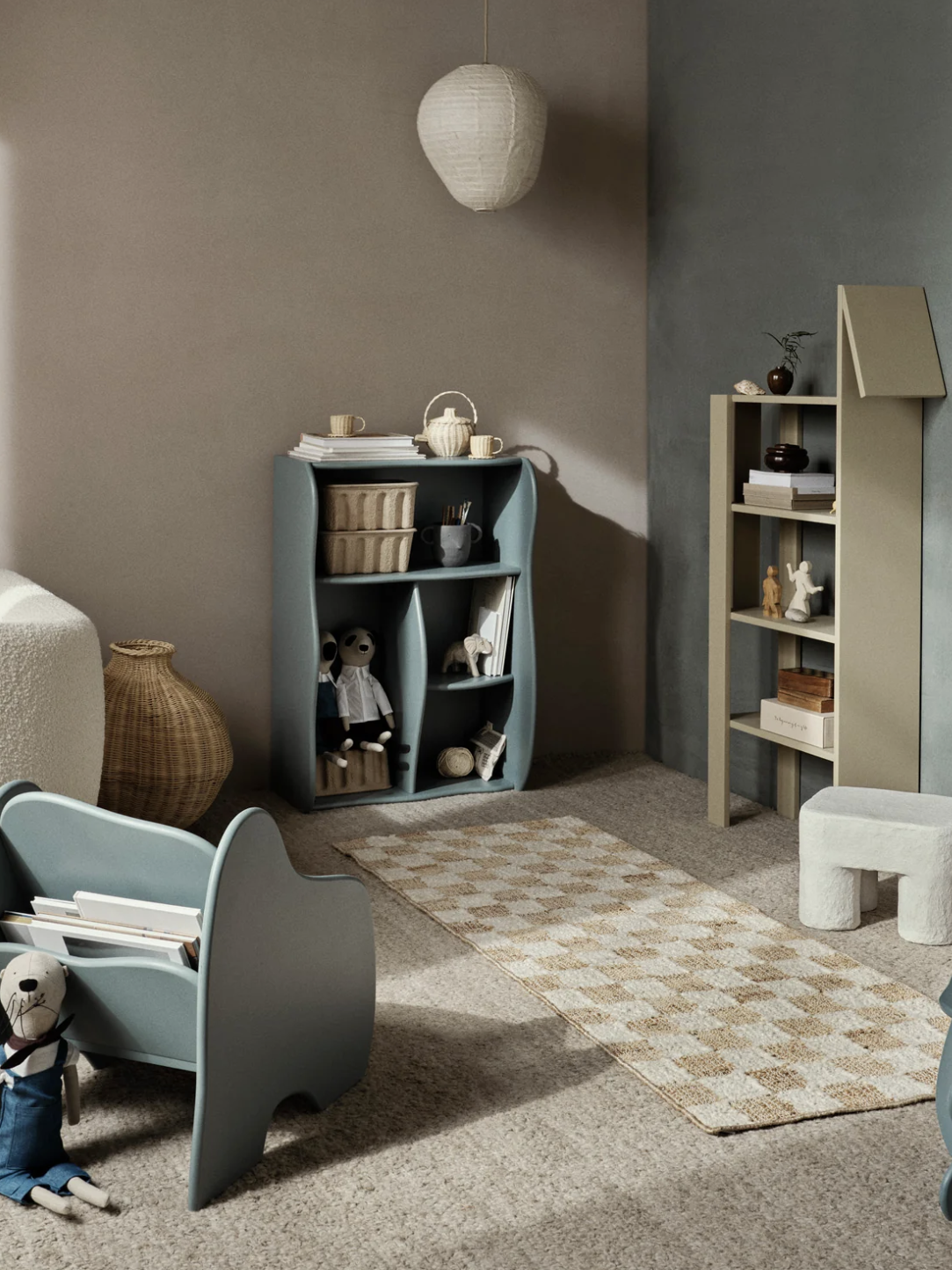 A chic children's room features modern furnishings, plush toys, a small bookshelf, and a checkered rug on a carpeted floor, all in neutral tones.