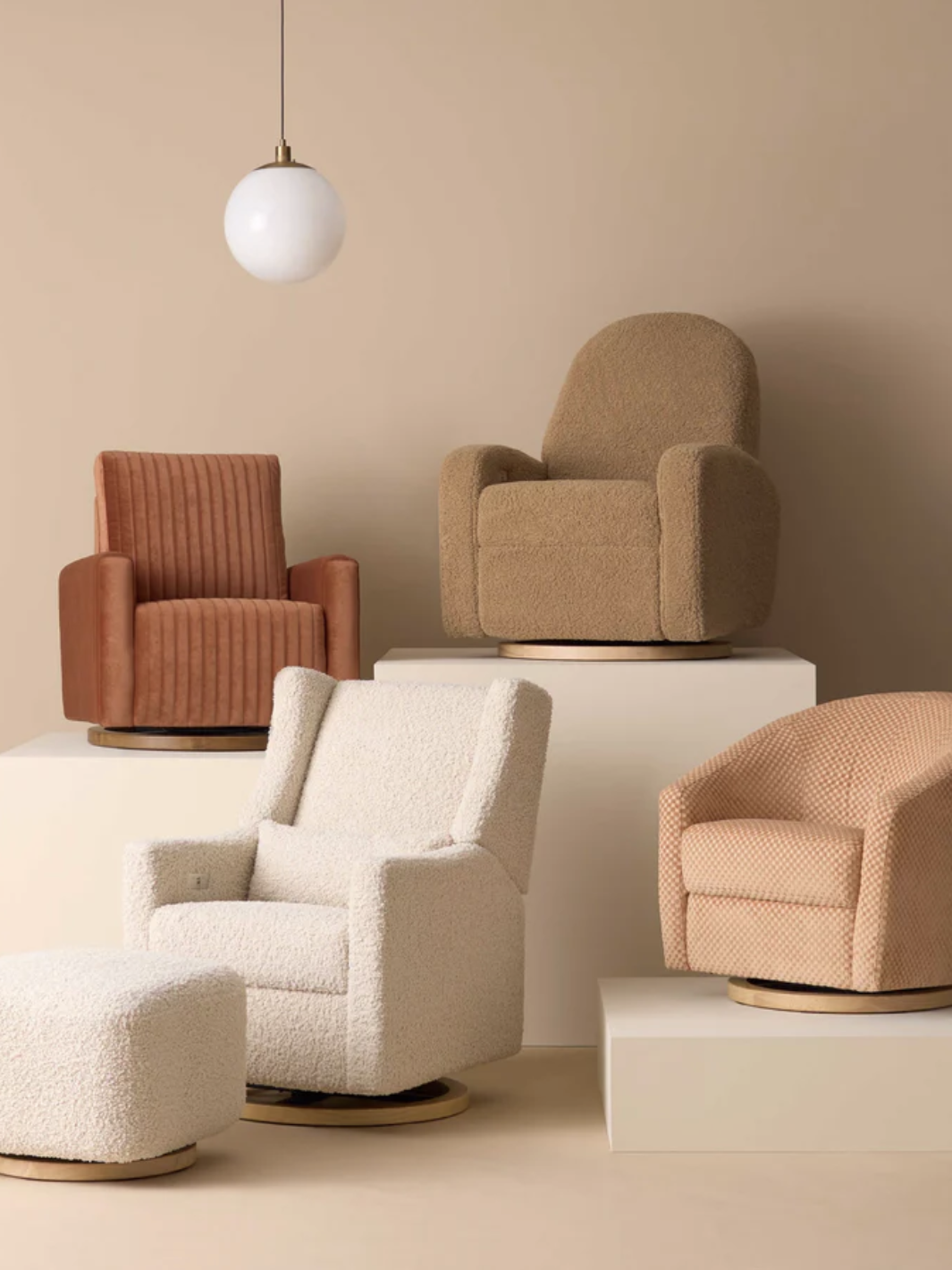 Four beige and brown upholstered armchairs and a matching ottoman are displayed on white platforms against a neutral background with a hanging spherical light fixture above.