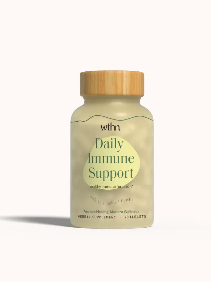 A bottle labeled "Daily Immune Support" by WTHN, featuring a wooden cap and containing 10 tablets.