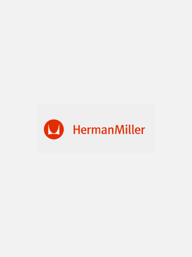 Herman Miller logo featuring an abstract red emblem next to the text "HermanMiller" in red on a white background.